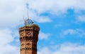 White stork Ciconia ciconia standing in nest on old high brick chimney Royalty Free Stock Photo