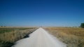 White straight dirt road on the way of Saint James, camino de santiago, Spain.