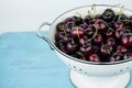 White strainer with cherries Royalty Free Stock Photo