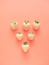 white strawberries arranged in a row forming a triangle Royalty Free Stock Photo