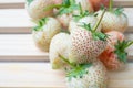 White strawberry , Pineapple Strawberry on wooden ,selective focus
