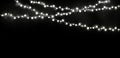 White string Christmas lights in black background for decoration and Abstract Holiday Background