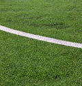 White stripe on green soccer field from top view