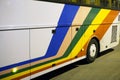 White stripe tour bus with tourists at night downtown the city Royalty Free Stock Photo