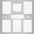 White striped note, notebook paper for message or text stuck on gray background with stars.