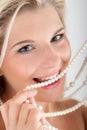 White strong teeth and pearls Royalty Free Stock Photo