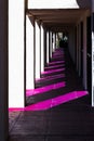 White stucco columns and dark shadows