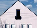 White stucco house exterior detail. small french balcony