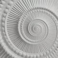 White stucco moulding plasterwork spiral abstract fractal pattern background. Plaster abstract spiral effect background element Royalty Free Stock Photo