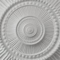 White stucco moulding plasterwork spiral abstract fractal pattern background. Plaster abstract spiral effect background element