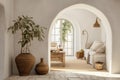 White stucco walls and arched doorway in farmhouse hallway. Rustic style interior design of boho entrance hall in country house