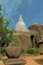 White Stupa and Exterior of the Isurumuniya rock temple Royalty Free Stock Photo