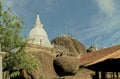 White Stupa and Exterior of the Isurumuniya rock temple Royalty Free Stock Photo