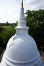 White stupa on the rock