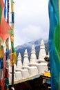 White stupas and prayer flags