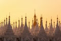 White stupas of Sanda Muni Pagoda at sunset in Mandalay Burma Myanmar