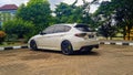 White Subaru WRX STI hatchback on a parking lot Royalty Free Stock Photo