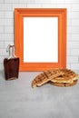 White subway tile blank empty orange wood frame with sweet syrup stack of homemade waffles