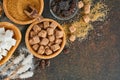 White sugar, cane sugar cubes, caramel in bamboo bowl on dark brown table concrete background. Assorted different types of sugar. Royalty Free Stock Photo