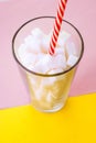 White sugar cubes in a glass with tubule