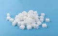 White Sugar Cubes Isolated on Blue Background Royalty Free Stock Photo