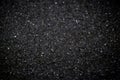 White sugar flakes turn into black scales that are color-coded with a photo editor. black color background Royalty Free Stock Photo