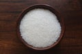 White sugar in wooden bowl