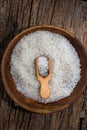 white sugar in wooden bowl, wooden scoop on old wooden background Royalty Free Stock Photo