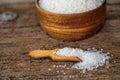 white sugar in wooden bowl, wooden scoop on old wooden background Royalty Free Stock Photo