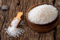 white sugar in wooden bowl, wooden scoop on old wooden background Royalty Free Stock Photo