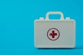 White suitcase with a red cross on a blue background