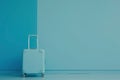 a white suitcase is sitting in front of a blue wall