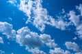 White summer clouds mosaic composition on blue sky background