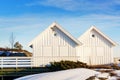 White summer cottage, windows with boards before the storm Royalty Free Stock Photo