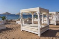 White sun canopy with mattress on luxury sand beach in tropical resort in Red Sea coast in Egypt, Africa Royalty Free Stock Photo