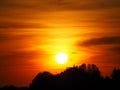 Sun with multicolored background over lake ivars and vila sana, lerida, spain, europe