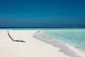 White sunbed near tropical calm beach with turquoise sea water and white sand. Maldives islands