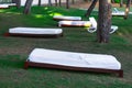 White sunbeds on green grass Royalty Free Stock Photo