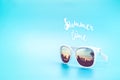 White Sunglasses reflection sunset at palm tree landscape scene