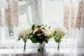 White sunlight illuminates three tender bouquets