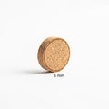 A white surface. Its texture is porous, typical of cork material. The Royalty Free Stock Photo