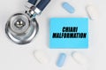 On a white surface lie pills, a stethoscope and stickers with the inscription - Chiari malformation Royalty Free Stock Photo