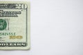 White surface with a twenty-dollar bill on the side - great for background