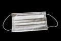 White Surgical Mask Isolated on Black Background