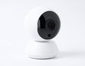 White Surveillance Camera with Black Lens on White Background for Security Royalty Free Stock Photo