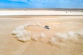 A white SUV car dune drifting in desert Royalty Free Stock Photo