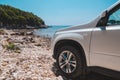 white suv car at summer sea beach Royalty Free Stock Photo