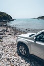 white suv car at summer sea beach Royalty Free Stock Photo
