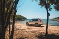 white suv car at summer sea beach Royalty Free Stock Photo