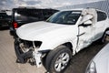 Damaged white SUV in parking lot after a collision Royalty Free Stock Photo
